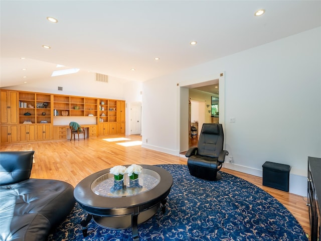 4 Terrace Ct, Port Washington, NY 11050 - living area with light wood-type flooring, lofted ceiling, and recessed lighting