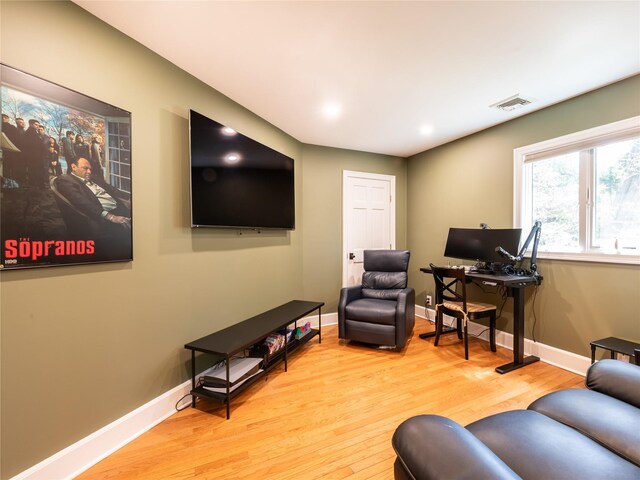 4 Terrace Ct, Port Washington, NY 11050 - living room with wood finished floors, baseboards, and a desk