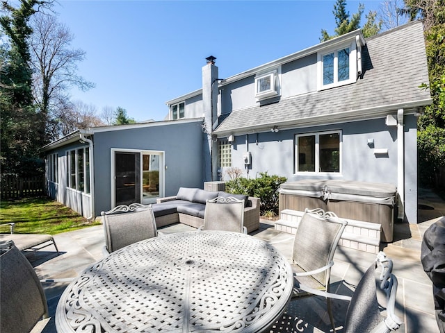 4 Terrace Ct, Port Washington, NY 11050 - back of house with a hot tub, stucco siding, outdoor dining space, and a patio area