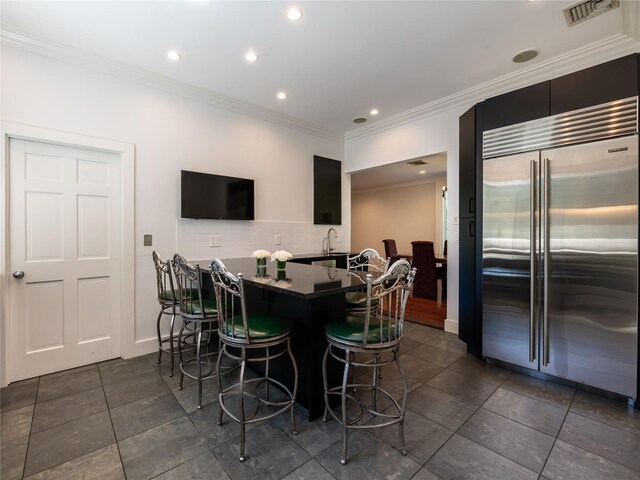 4 Terrace Ct, Port Washington, NY 11050 - dining space featuring crown molding, dark tile patterned floors, recessed lighting, and baseboards