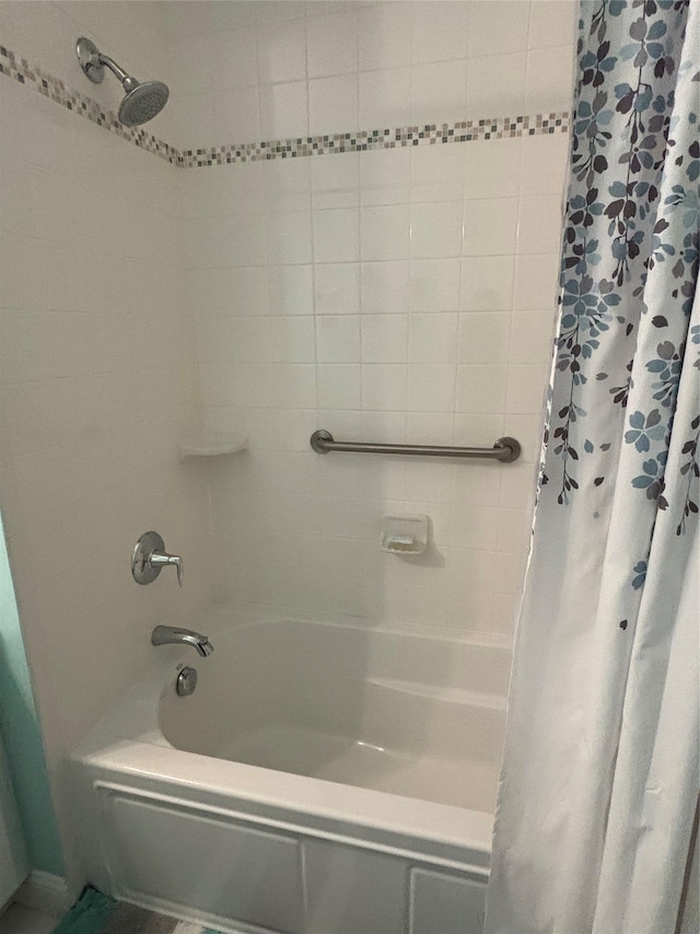 full bath with shower / bath combination with curtain