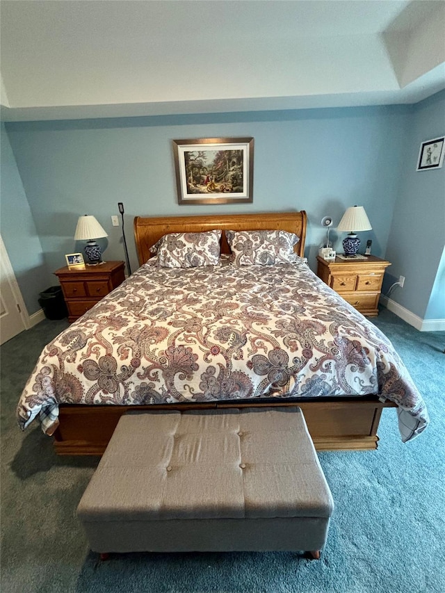 bedroom featuring baseboards and carpet floors