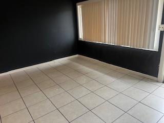 spare room with light tile patterned floors