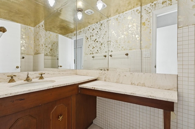 270 Bayberry Dr, Hewlett Harbor, NY 11557 - bathroom featuring tile walls, wallpapered walls, and vanity