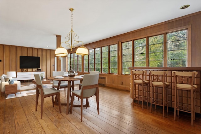 270 Bayberry Dr, Hewlett Harbor, NY 11557 - dining area featuring radiator, a healthy amount of sunlight, and light wood-style floors