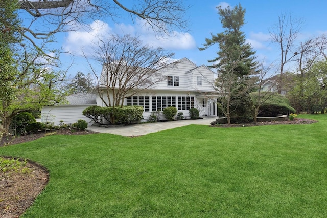 270 Bayberry Dr, Hewlett Harbor, NY 11557 - back of property featuring a yard and a patio