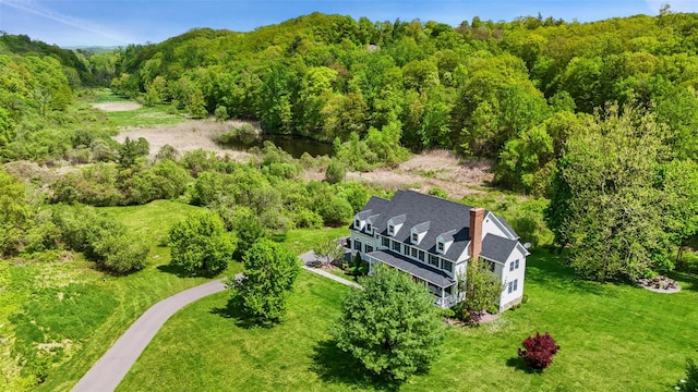 view from above of property featuring a forest