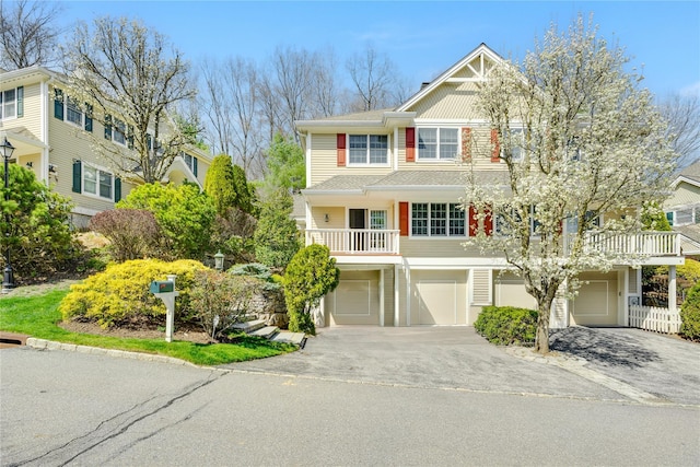 8 Alder Way, Armonk, NY 10504 - view of front of house featuring concrete driveway and an attached garage