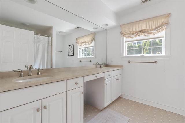 8 Alder Way, Armonk, NY 10504 - bathroom with double vanity, a sink, baseboards, and a healthy amount of sunlight