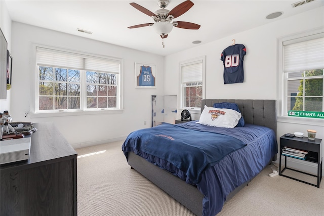 8 Alder Way, Armonk, NY 10504 - carpeted bedroom with a ceiling fan, multiple windows, and visible vents