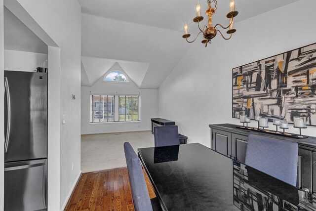 13 Iris Cir, Beacon, NY 12508 - dining room featuring baseboards, an inviting chandelier, wood finished floors, and vaulted ceiling