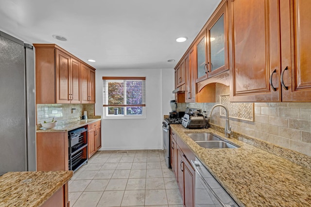 13 Iris Cir, Beacon, NY 12508 - kitchen with light stone countertops, baseboards, tasteful backsplash, a sink, and stainless steel appliances