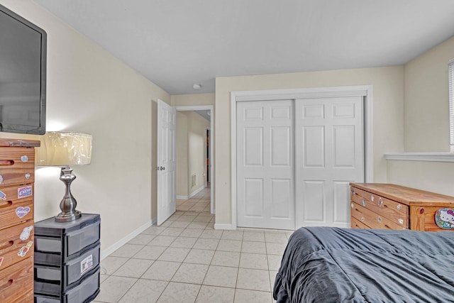 13 Iris Cir, Beacon, NY 12508 - bedroom featuring a closet, baseboards, and light tile patterned floors