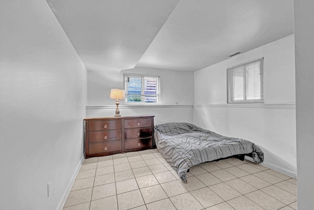 13 Iris Cir, Beacon, NY 12508 - bedroom with baseboards, visible vents, and light tile patterned floors