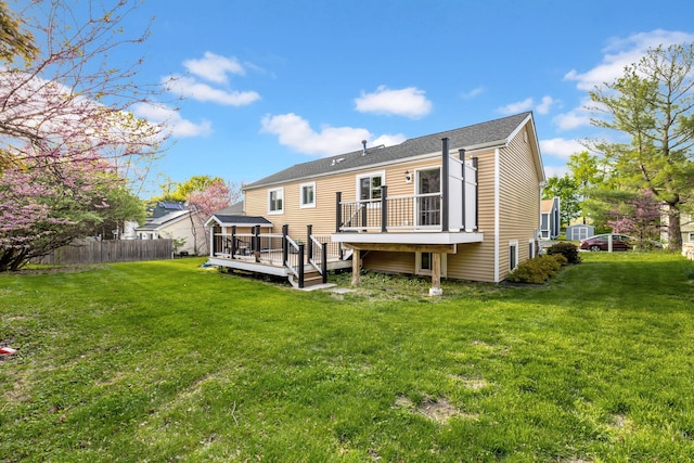 13 Iris Cir, Beacon, NY 12508 - back of property featuring a lawn, fence, and a wooden deck