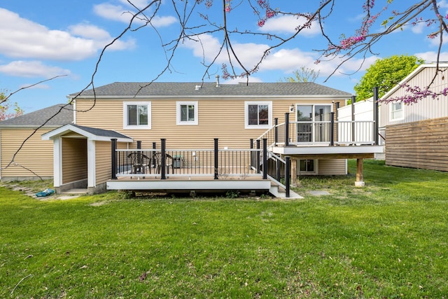 13 Iris Cir, Beacon, NY 12508 - rear view of property with a lawn, a deck, and a shingled roof