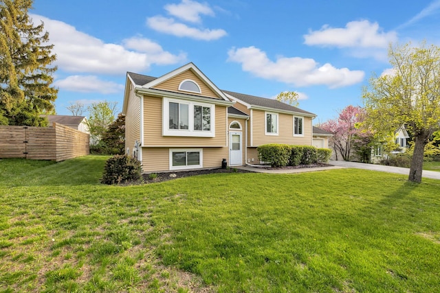 13 Iris Cir, Beacon, NY 12508 - split foyer home with a garage, a front lawn, fence, and driveway
