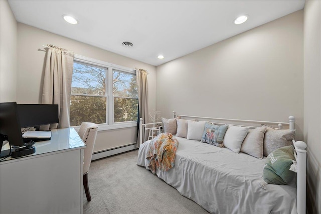 carpeted bedroom featuring a baseboard heating unit, visible vents, and recessed lighting