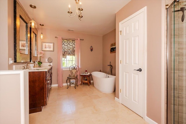 full bath with visible vents, vanity, baseboards, an enclosed shower, and a freestanding bath