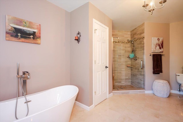 full bath with baseboards, a soaking tub, and a stall shower