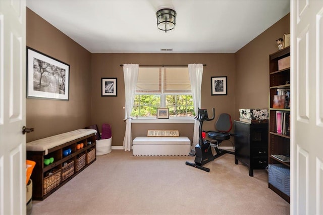 interior space featuring baseboards, carpet, and visible vents