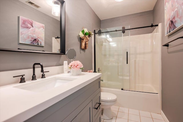 full bathroom with tile patterned flooring, vanity, toilet, combined bath / shower with glass door, and visible vents