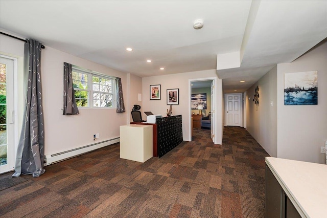 home office featuring recessed lighting, a baseboard heating unit, and dark carpet