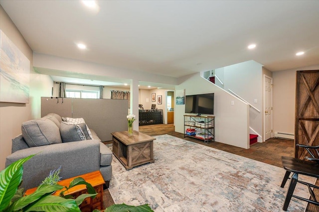 living room with stairs, recessed lighting, and a baseboard heating unit