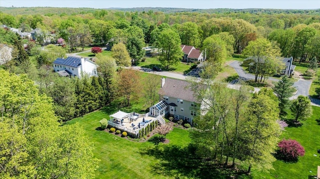 aerial view with a wooded view