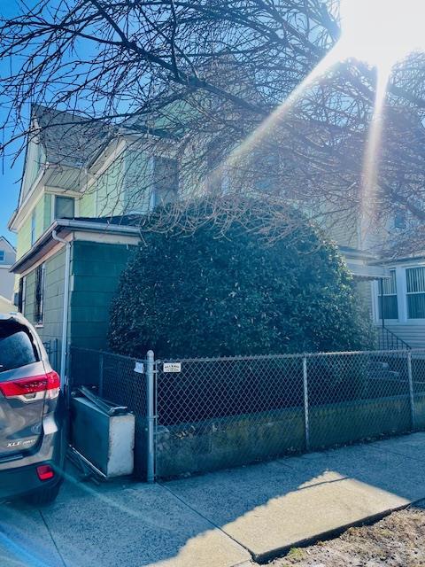 view of side of home featuring a fenced front yard