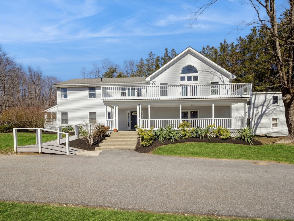 324 Fair St, Carmel, NY 10512 - view of front facade with a porch, a balcony, and a shingled roof