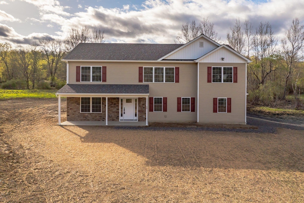 169 Mulford Rd, Middletown, NY 10940 - traditional-style home featuring covered porch, board and batten siding, brick siding, and a shingled roof