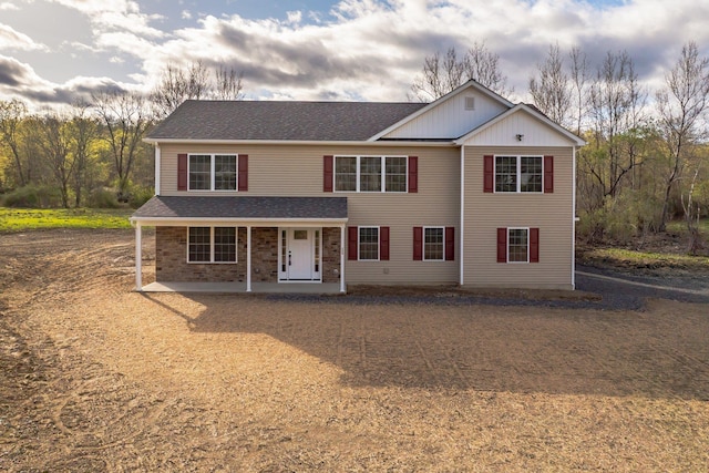 169 Mulford Rd, Middletown, NY 10940 - traditional-style home featuring covered porch, board and batten siding, brick siding, and a shingled roof