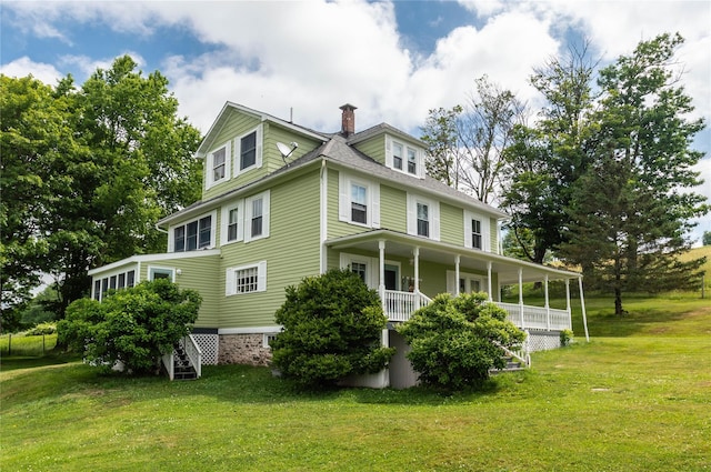 535 Beechwoods Rd, Callicoon, NY 12723 - rear view of house featuring stairway, a yard, covered porch, and a chimney