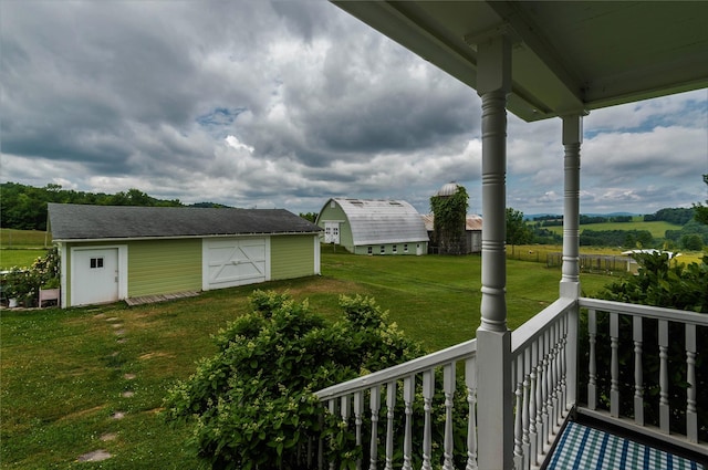 535 Beechwoods Rd, Callicoon, NY 12723 - view of green lawn with covered porch, an outdoor structure, and a detached garage