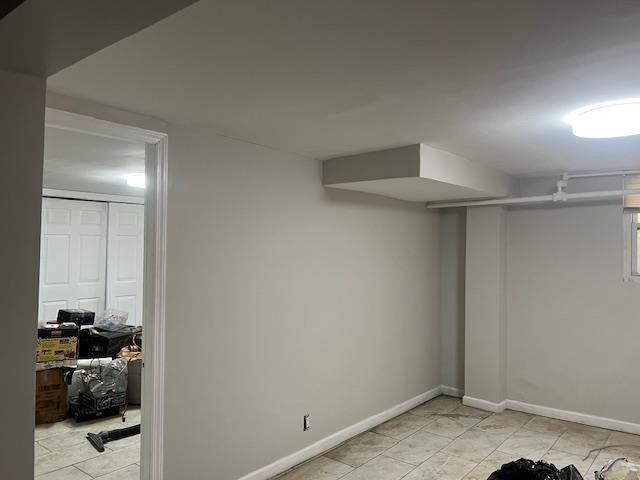 20-25 Parsons Blvd, Whitestone, NY 11357 - finished below grade area with baseboards and light tile patterned floors