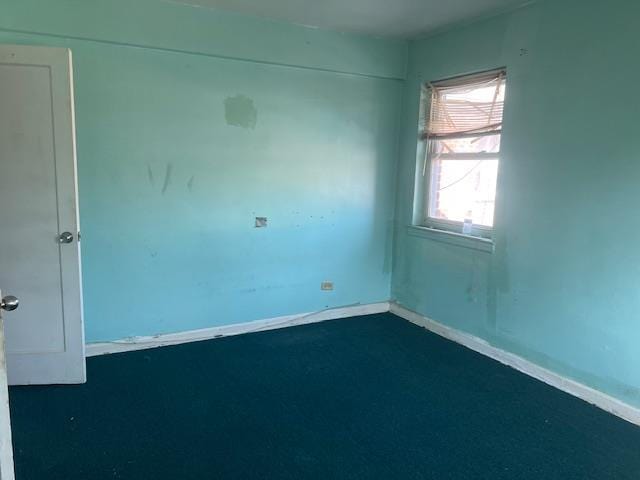 20-25 Parsons Blvd, Whitestone, NY 11357 - unfurnished room with dark carpet and baseboards