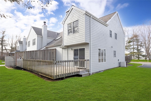 8 Beach Manor Ct, West Islip, NY 11795 - back of property with roof with shingles, a wooden deck, and a lawn