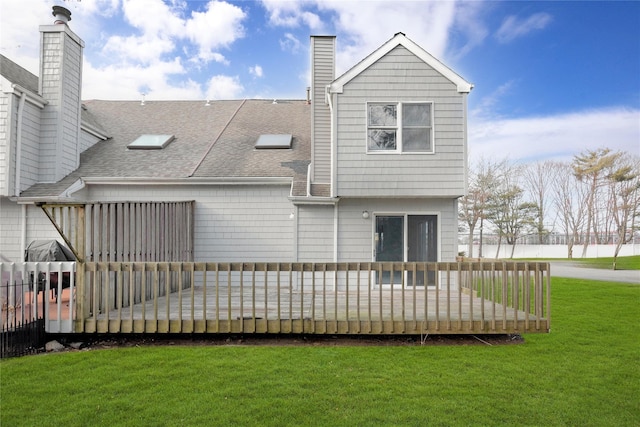 8 Beach Manor Ct, West Islip, NY 11795 - back of house featuring roof with shingles, a deck, a lawn, and a chimney