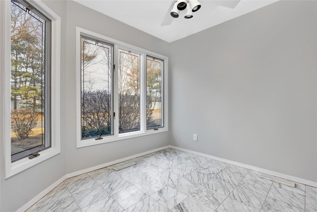 8 Beach Manor Ct, West Islip, NY 11795 - spare room with ceiling fan, marble finish floor, plenty of natural light, and baseboards