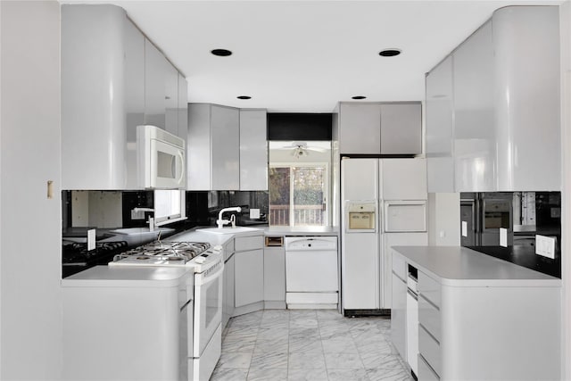 8 Beach Manor Ct, West Islip, NY 11795 - kitchen with tasteful backsplash, a sink, ceiling fan, white appliances, and marble finish floor