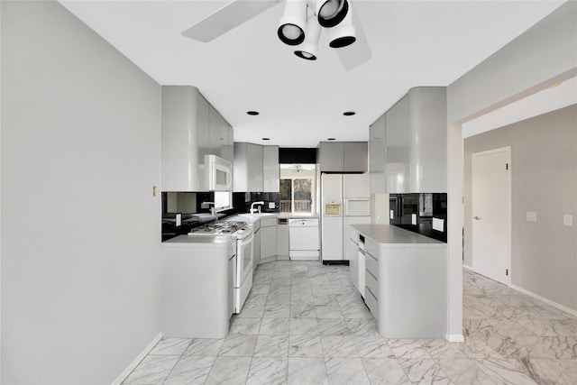 8 Beach Manor Ct, West Islip, NY 11795 - kitchen featuring a ceiling fan, marble finish floor, baseboards, and white appliances