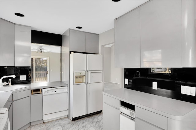 8 Beach Manor Ct, West Islip, NY 11795 - kitchen with ceiling fan, white appliances, marble finish floor, light countertops, and a sink