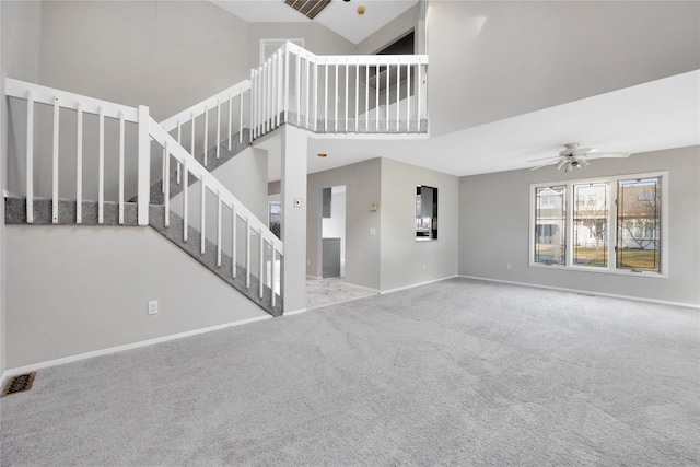8 Beach Manor Ct, West Islip, NY 11795 - unfurnished living room with a towering ceiling, baseboards, stairway, visible vents, and carpet