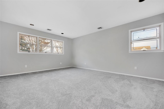 8 Beach Manor Ct, West Islip, NY 11795 - spare room featuring visible vents, baseboards, and carpet floors
