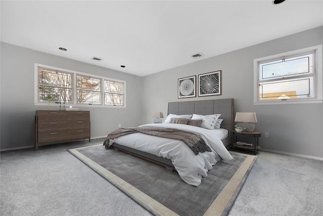 8 Beach Manor Ct, West Islip, NY 11795 - carpeted bedroom featuring visible vents, baseboards, and multiple windows