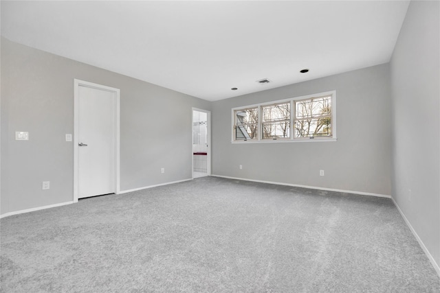 8 Beach Manor Ct, West Islip, NY 11795 - spare room with carpet flooring, visible vents, and baseboards