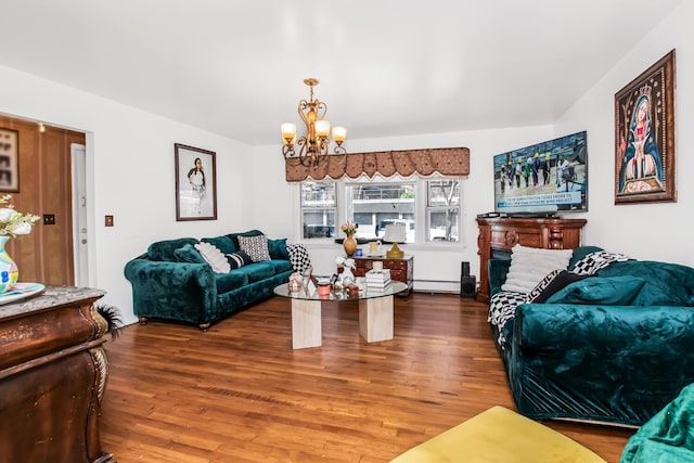 living room with a baseboard heating unit, wood finished floors, and a chandelier