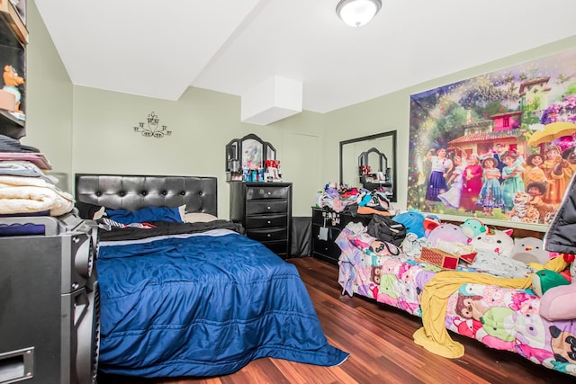 bedroom featuring wood finished floors