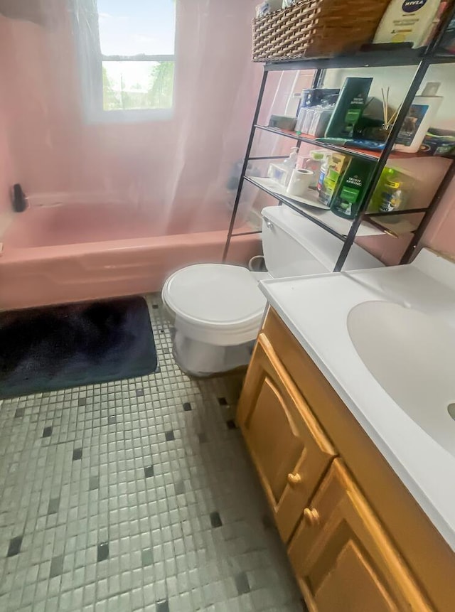 full bath featuring shower / bathing tub combination, tile patterned flooring, vanity, and toilet